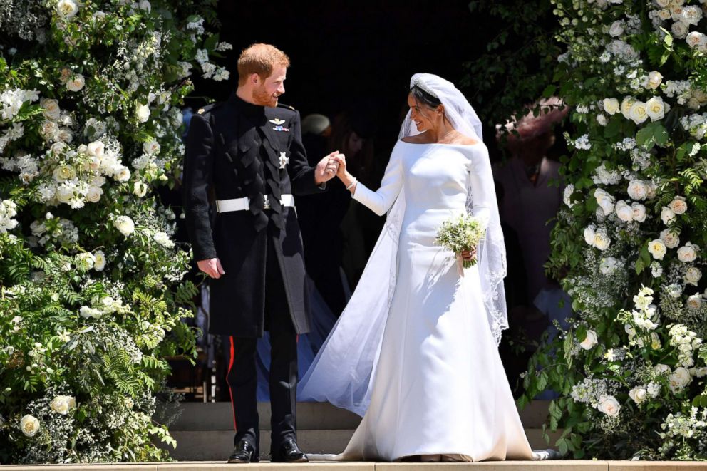 PHOTO: Prince Harry and Meghan Markle leave from the West Door of St George's Chapel, Windsor Castle, May 19, 2018, in Windsor, England. 