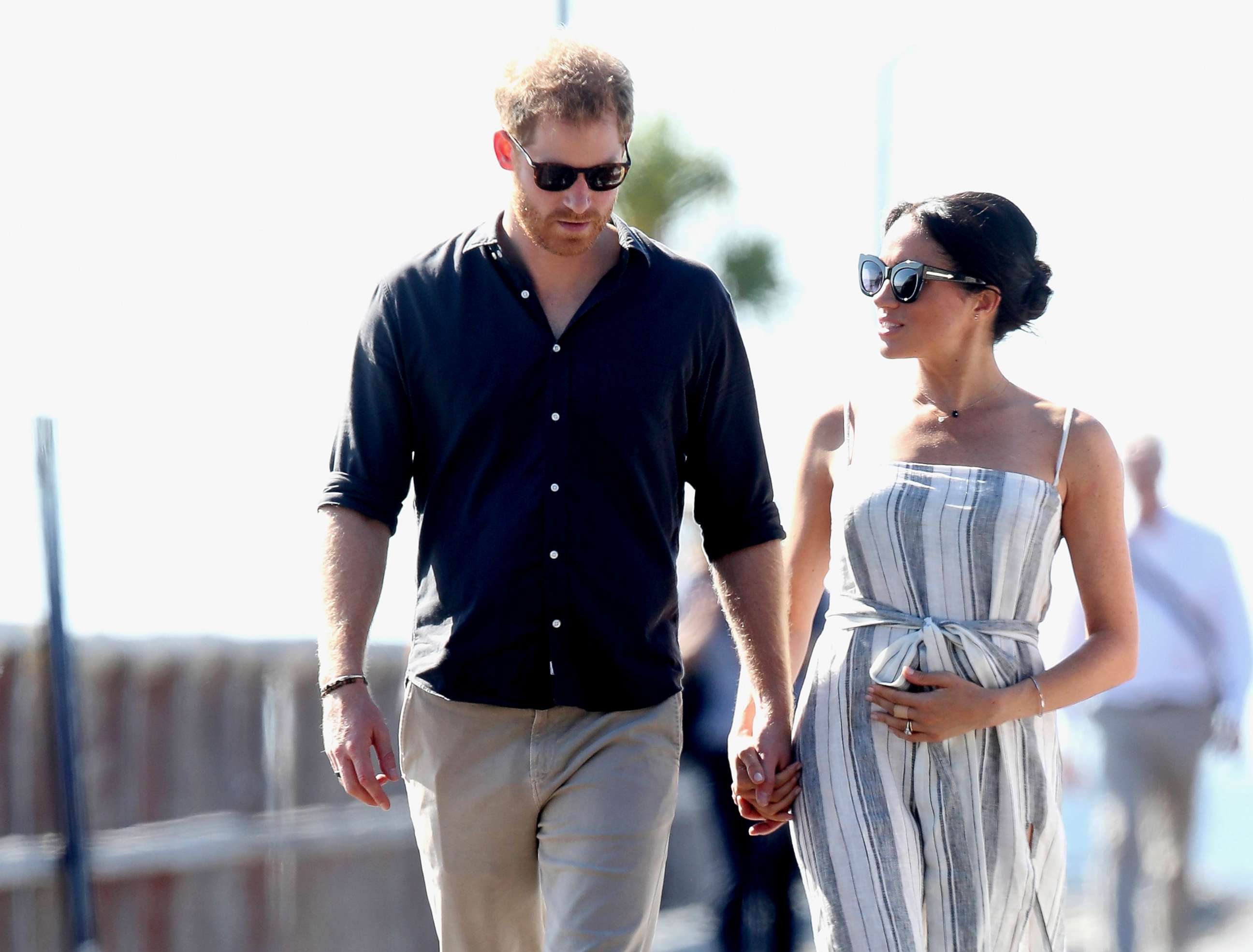 PHOTO: Prince Harry, Duke of Sussex and Meghan, Duchess of Sussex walk along Kingfisher Bay Jetty, Oct. 22, 2018, in Fraser Island, Australia.