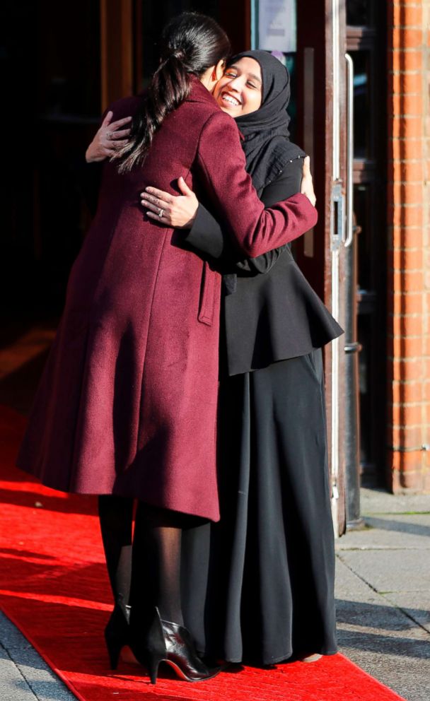 PHOTO: Meghan Markle, Duchess of Sussex hugs Zaheera Sufyaan, Hubb Community Kitchen co-coordinator, as she leaves after attending the premises in London, Nov. 21, 2018, to celebrate the success of their cookbook.