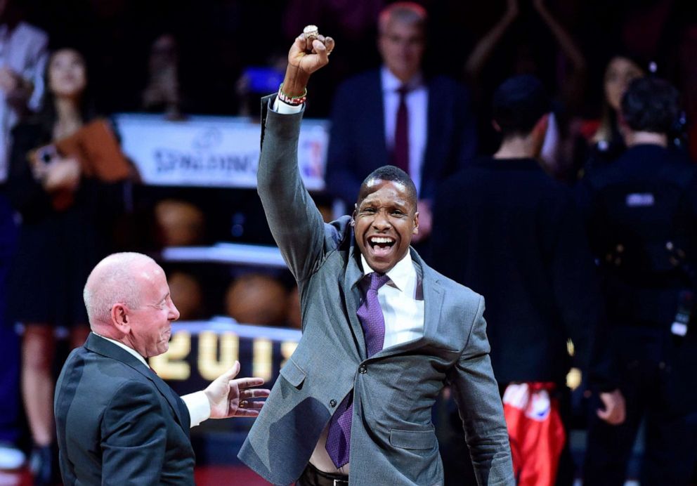 PHOTO: Toronto Raptors president Masai Ujiri after receiving his 2019 NBA basketball championship ring from Larry Tanenbaum, chairman of Maple Leaf Sports & Entertainment, before the Raptors played the New Orleans Pelicans in Toronto, Oct. 29, 2019.
