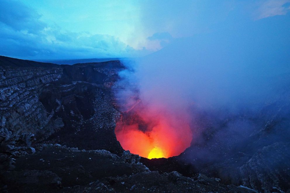PHOTO: The lava pool glows from the crater of the Masaya Volcano at twilight, Masaya, Nicaragua.