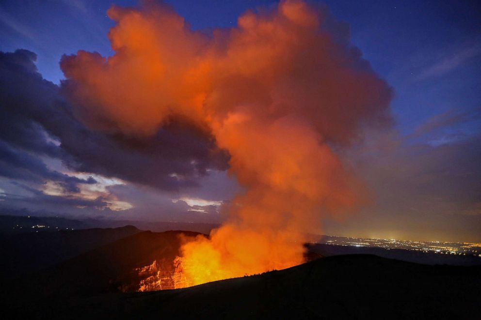 PHOTO: Steam reflects the light from hot lava inside the Masaya Volcano in Nicaragua.
