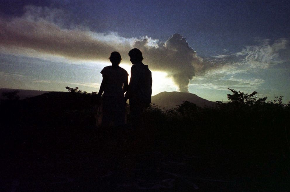 PHOTO: A couple looks at clouds erupting from Masaya Volcano, 13 miles from Managua, Nicaragua, April 23, 2001.