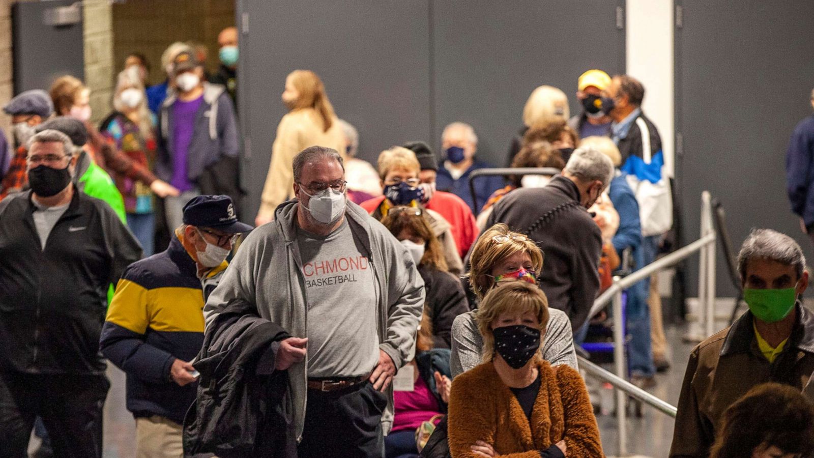 PHOTO: People wait to receive a COVID-19 vaccine inside the Charleston Convention Center in Charleston, W.V.