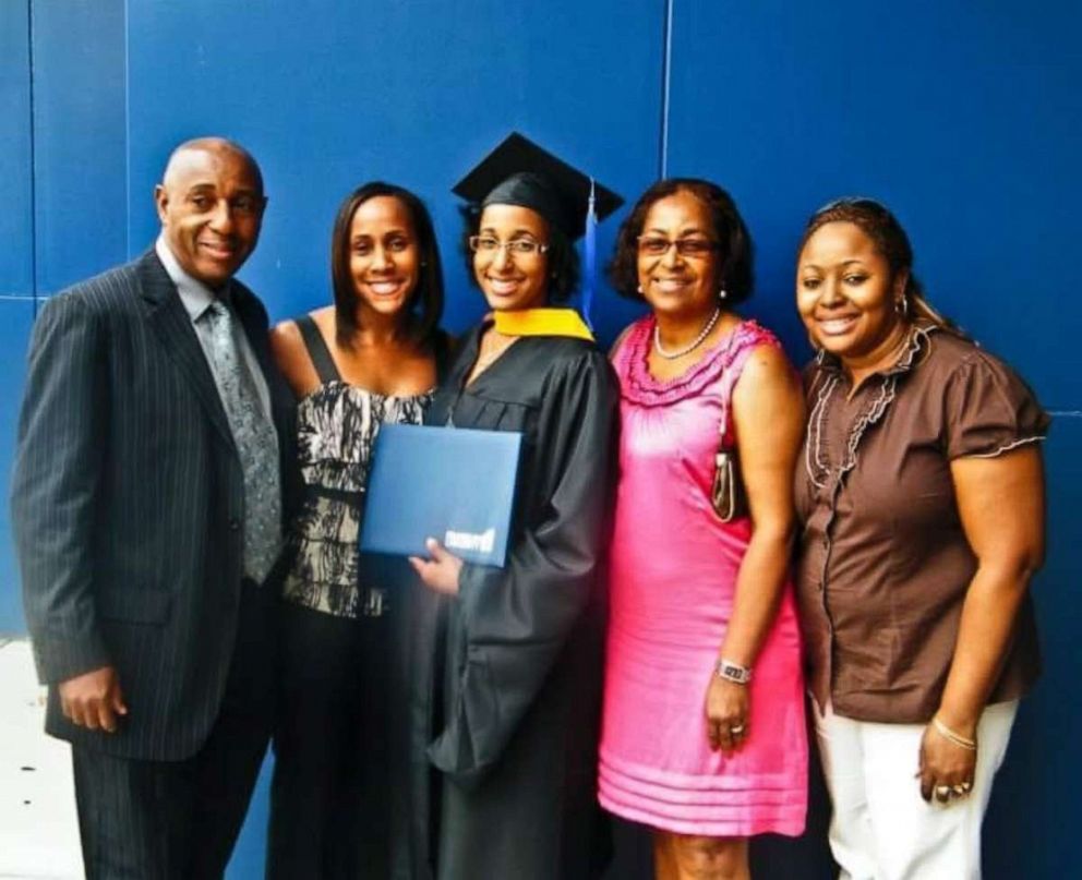 PHOTO: Jordanne Wells poses with her family after her graduation from Franklin University with a master's degree in 2010. 