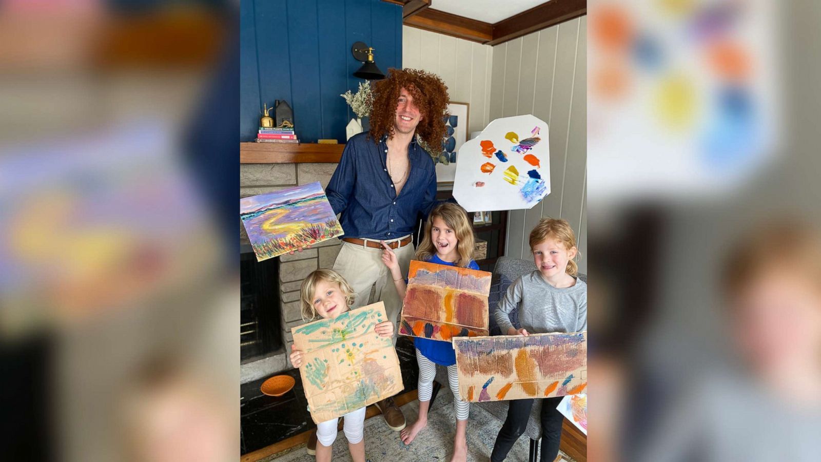 PHOTO: Matt Nestheide dressed as iconic scenery painter, Bob Ross, poses with children, Cole, Sydney, and Mila.