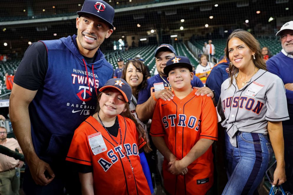 PHOTO: Carlos Correa, of the Minnesota Twins, stands alongside Mayah Nicole Zamora, and the Zamora family at Minute Maid Park on August 23, 2022 in Houston, Texas.