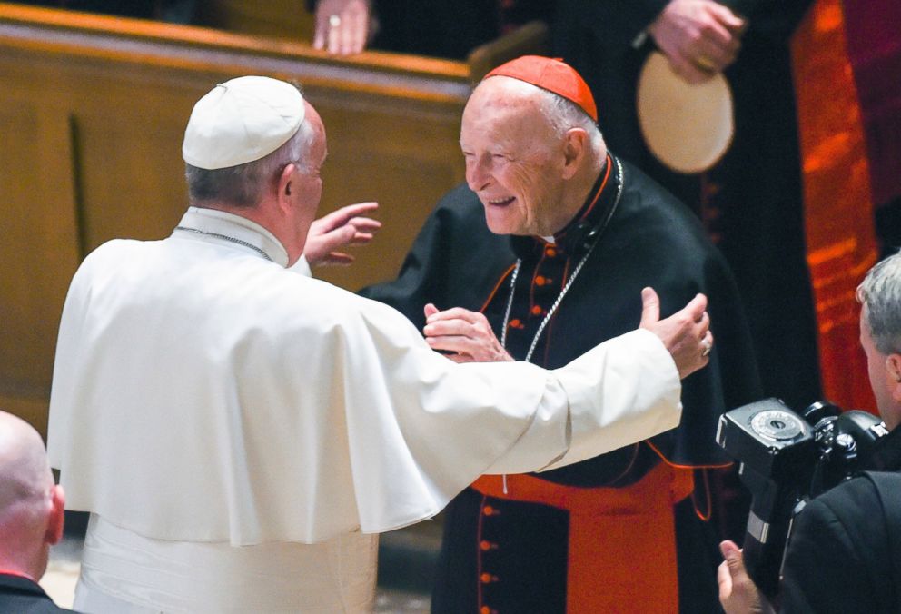 In this Sept. 23, 2015 file photo, Pope Francis reaches out to hug Cardinal Archbishop emeritus Theodore McCarrick after the Midday Prayer of the Divine with more than 300 U.S. Bishops at the Cathedral of St. Matthew the Apostle in Washington.
