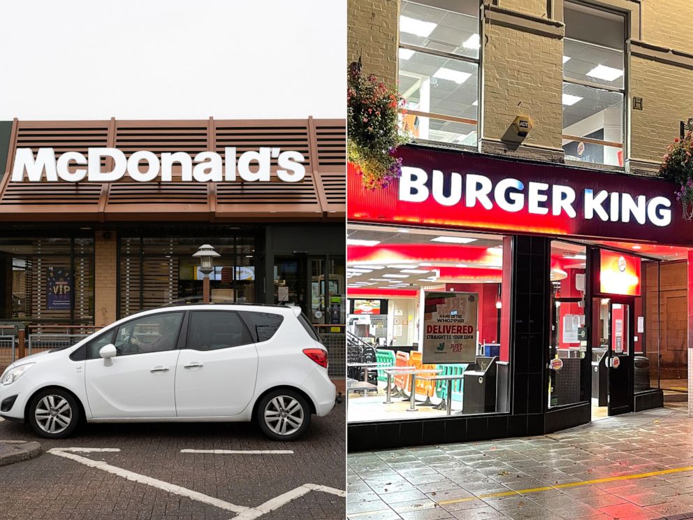 PHOTO: In this March 18, 2020, file photo, a McDonald’s restaurant is shown in Cardiff, Wales. | A Burger King restaurant sits empty on Oct. 24, 2020, in Cardiff, Wales. 