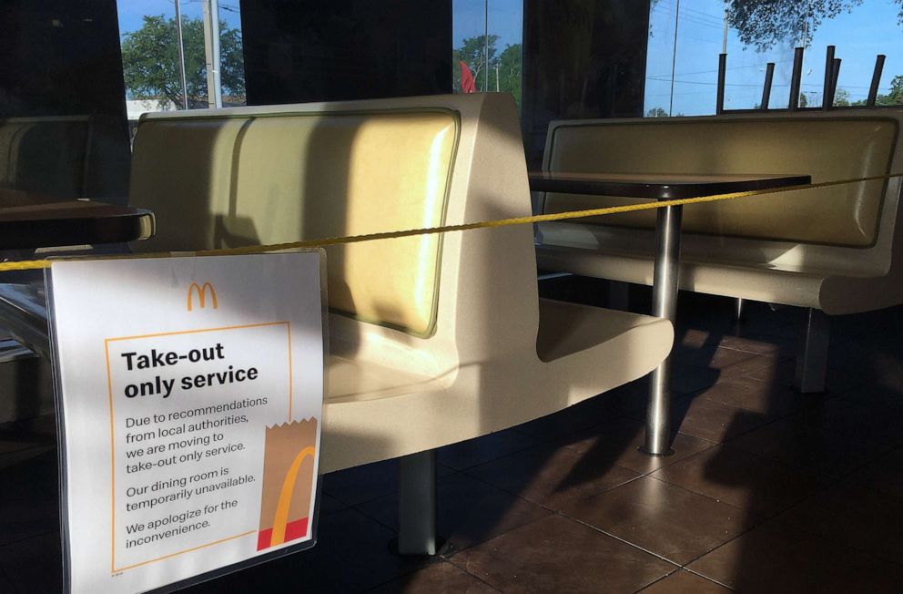 PHOTO: A dining room at a McDonald's restaurant in Titusville, Fla., is seen roped off during the coronavirus pandemic, March 18, 2020.