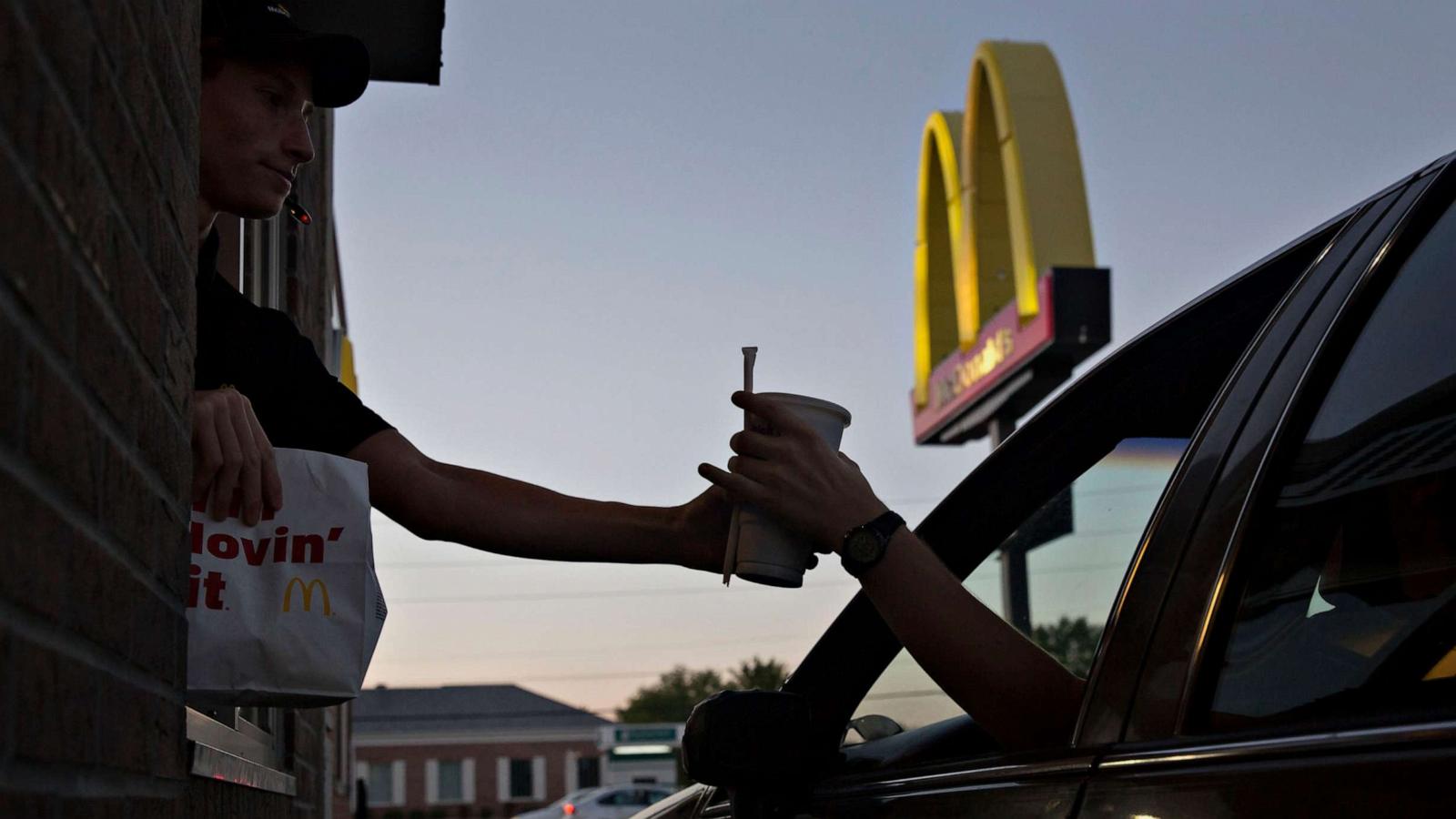 PHOTO: An employee hands a beverage to a customer at the drive-thru window of a McDonald's Corp. restaurant in Peru, Illinois, July 20, 2015.