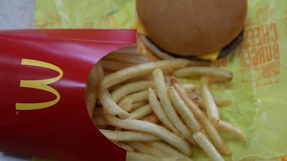 PHOTO: In this photo illustration, a McDonald's cheeseburger and fries are displayed on a table at a McDonald's restaurant on Dec. 8, 2014 in Novato, Calif.