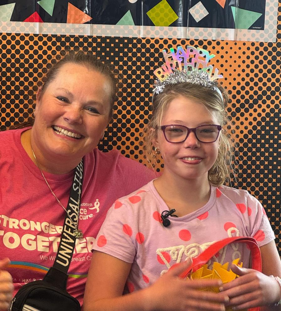 PHOTO: Eleanor Evenson smiles for a photo with police officer Angi Kruyer, who helped deliver her back in 2014.