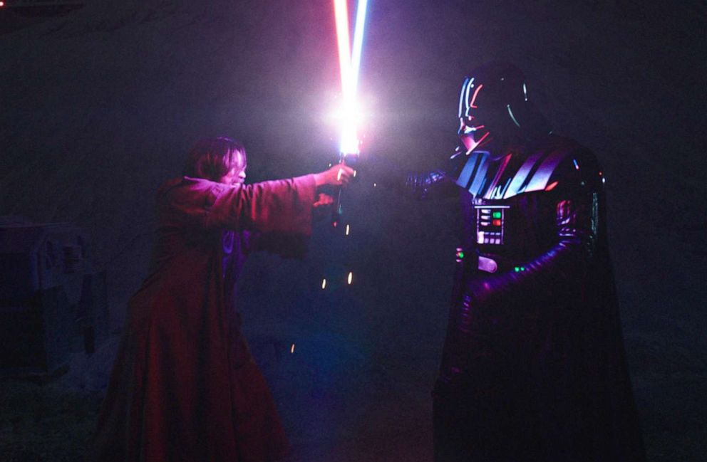 PHOTO: Obi-Wan Kenobi (Ewan McGregor) and Darth Vader (Hayden Christensen) clash lightsabers in "Obi-Wan Kenobi" on Disney+.