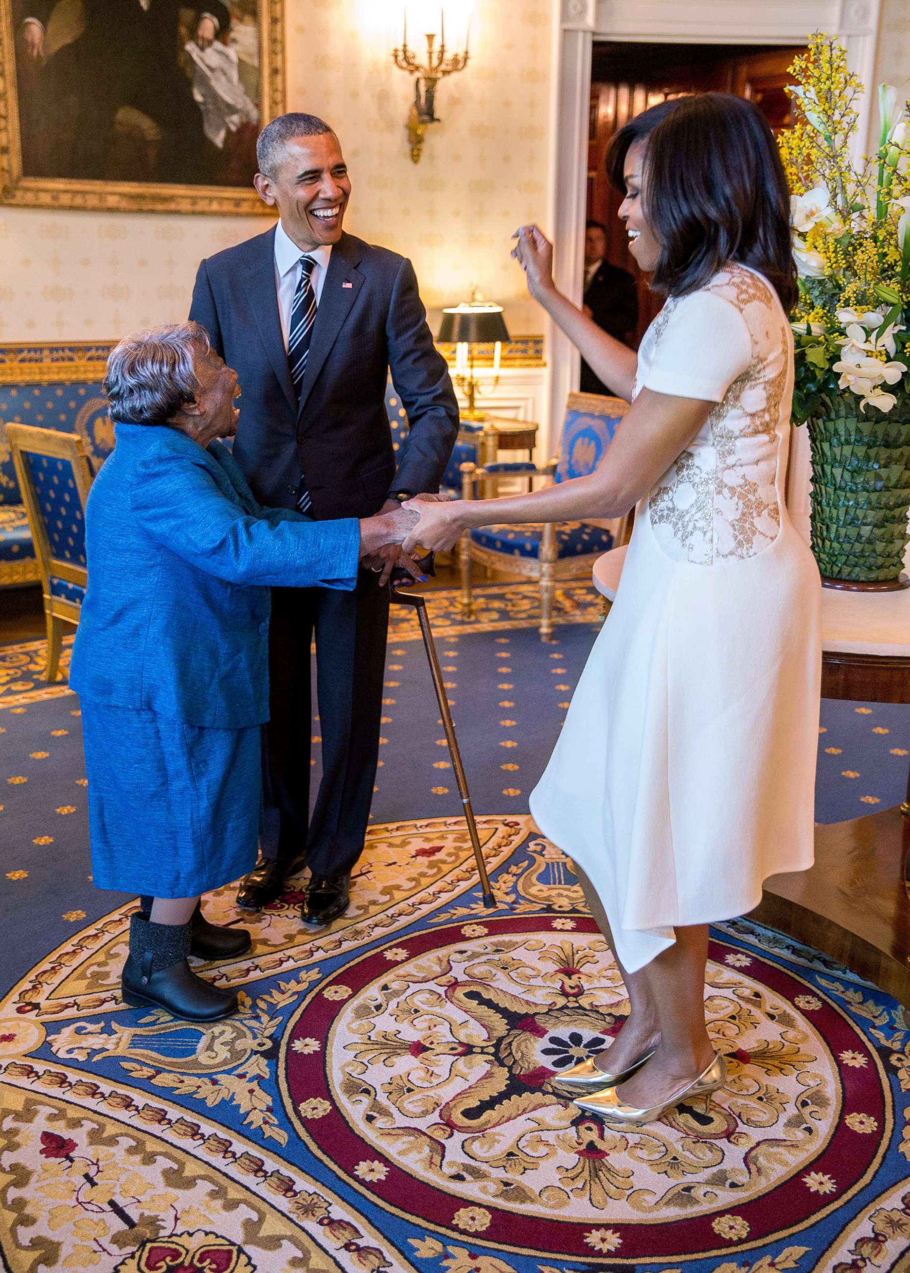 PHOTO: President Barack Obama watches First Lady Michelle Obama dance with Virginia McLaurin in the Blue Room of the White House prior to a reception celebrating African American History Month, Feb. 18, 2016.