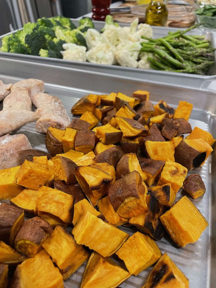 PHOTO: Sweet potatoes and other ingredients on sheet trays for meal prep.