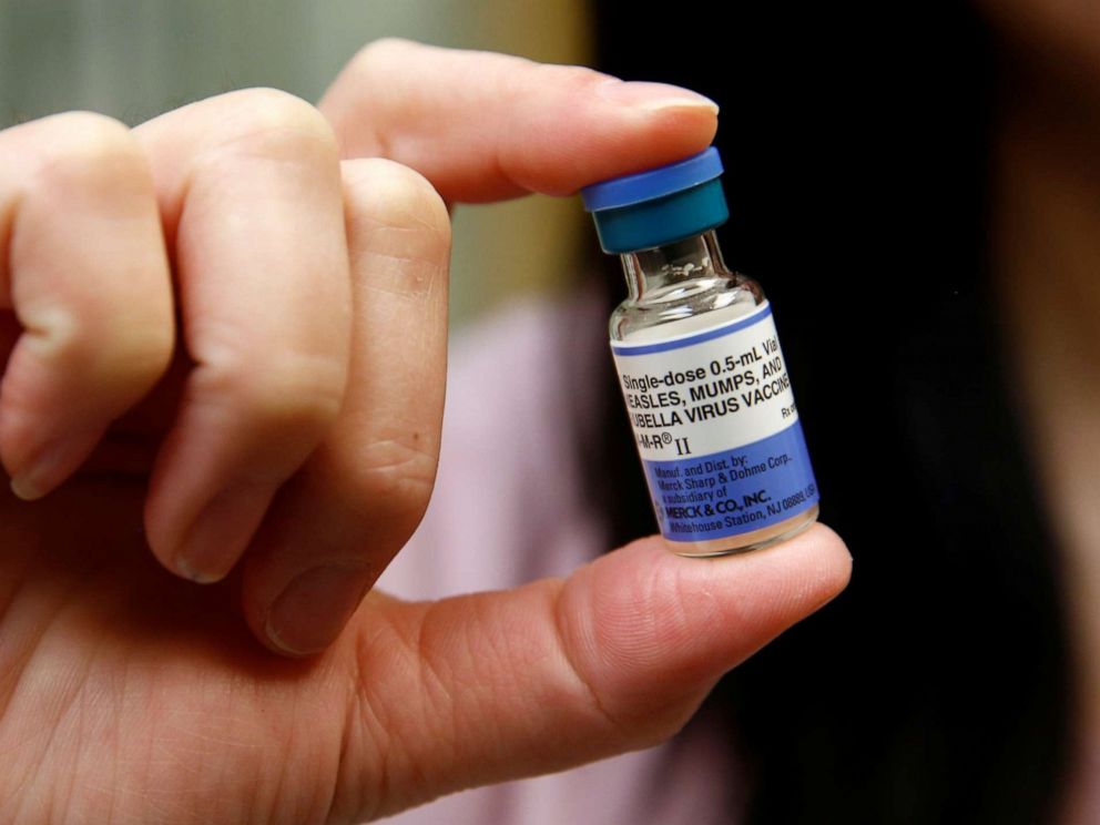 PHOTO: A medical assistant at the International Community Health Services clinic in Seattle holds a vial of the measles, mumps, and rubella virus vaccine o March 20, 2019.