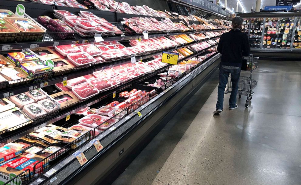 PHOTO:A shopper pushes his cart past a display of packaged meat in a grocery store Sunday, May 10, 2020, in Denver.