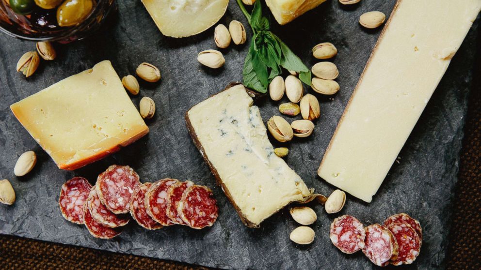 PHOTO: Meat, cheese and nuts on a slate board are seen in this stock photo.