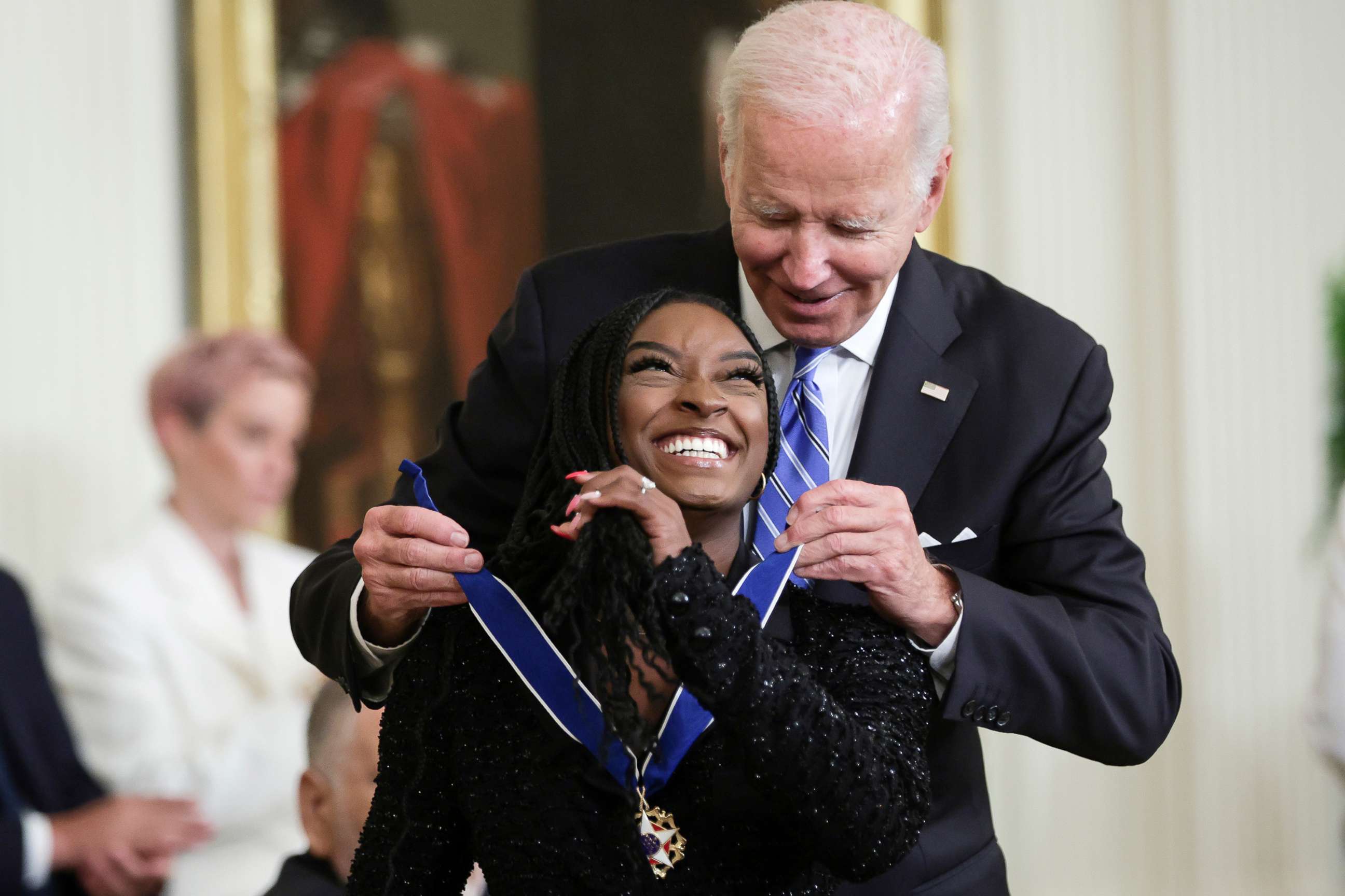 PHOTO: President Joe Biden presents the Presidential Medal of Freedom to Simone Biles, Olympic gold medal gymnast and mental health advocate, during a ceremony in the East Room of the White House, July 7, 2022, in Washington, D.C.