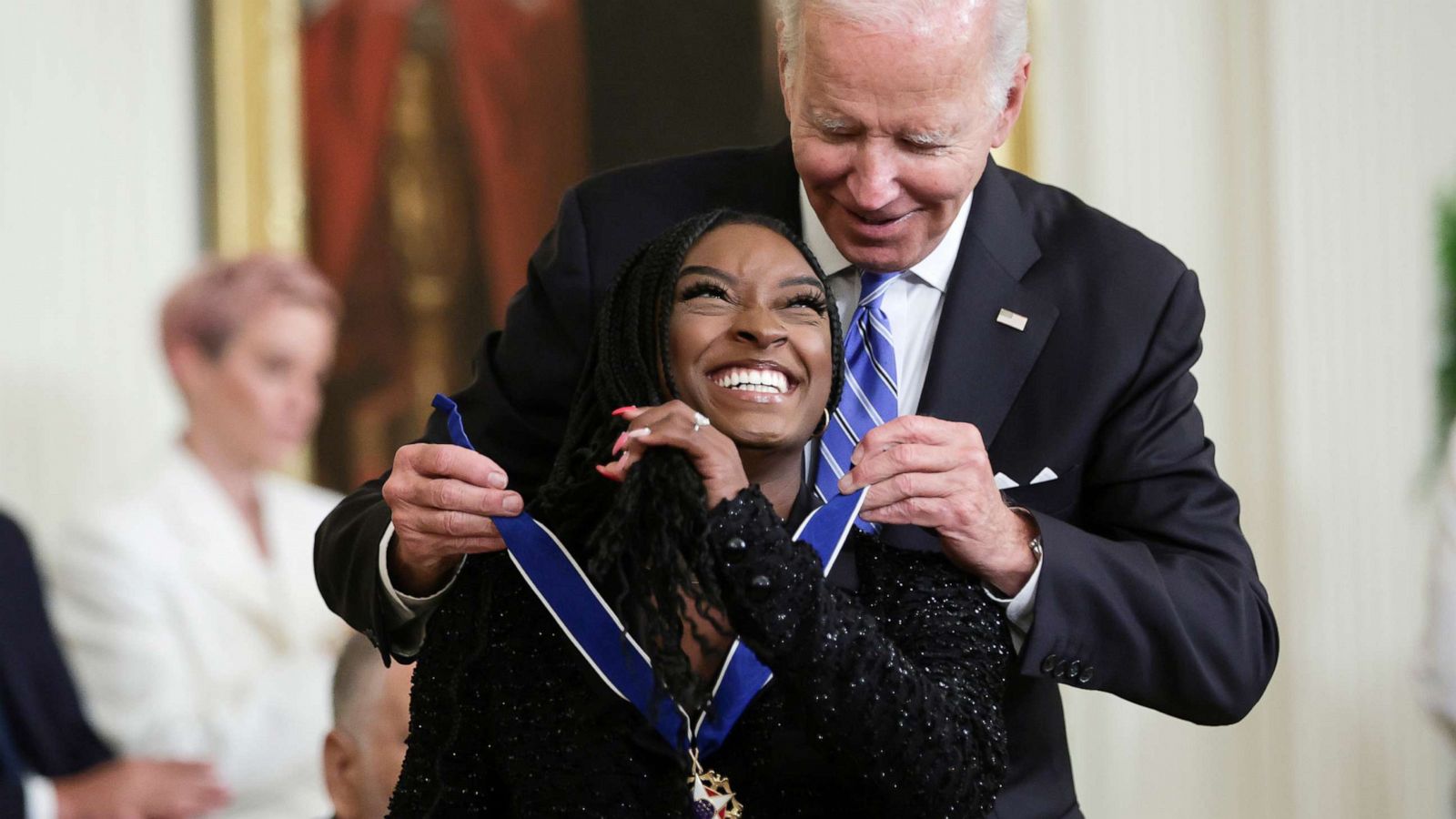 PHOTO: President Joe Biden presents the Presidential Medal of Freedom to Simone Biles, Olympic gold medal gymnast and mental health advocate, during a ceremony in the East Room of the White House, July 7, 2022, in Washington, D.C.