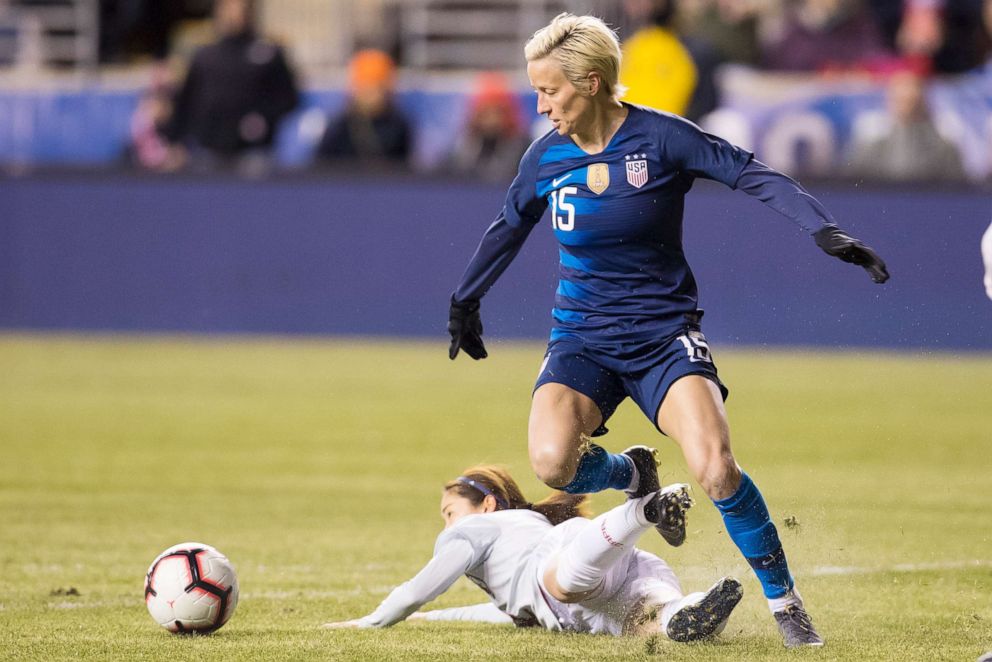 PHOTO: In this Feb. 27, 2019, file photo, Megan Rapinoe, of the U.S., right, and Japan's Risa Shimizu, left, go after the ball during the first half of SheBelieves Cup soccer match in Chester, Pa.
