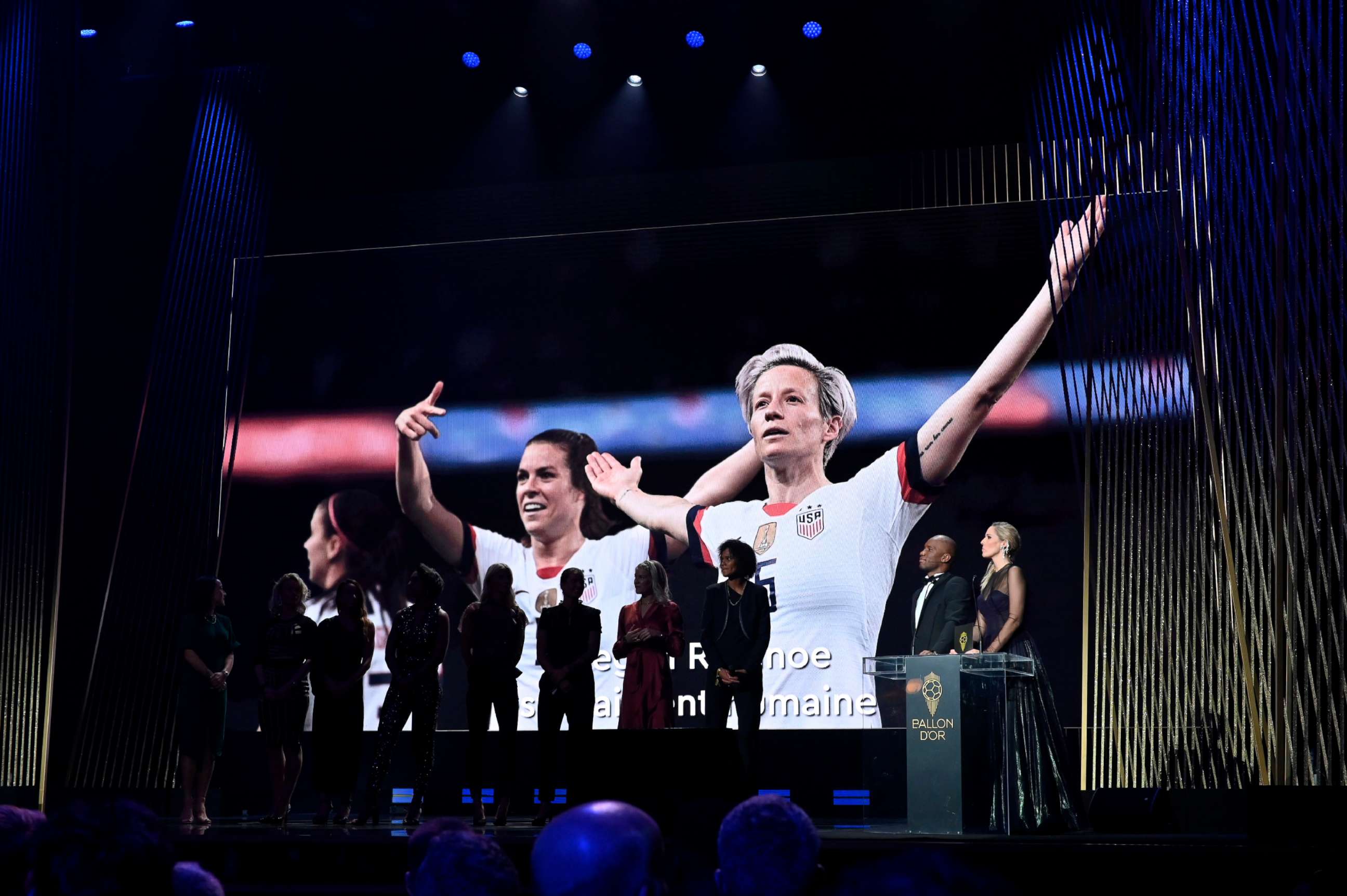 PHOTO: Megan Rapinoe, who was unable to except her award in person, wins the Ballon D'Or award during the Ballon D'Or Ceremony at Theatre Du Chatelet on Dec. 2, 2019 in Paris. The 2019 female nominees pose onstage in her absence.