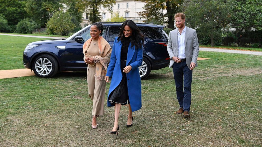PHOTO: In this Sept. 20, 2018, file photo, Meghan, the Duchess of Sussex, accompanied by Prince Harry, the Duke of Sussex and her mother Doria Ragland, walk to attend a reception at Kensington Palace, in London.