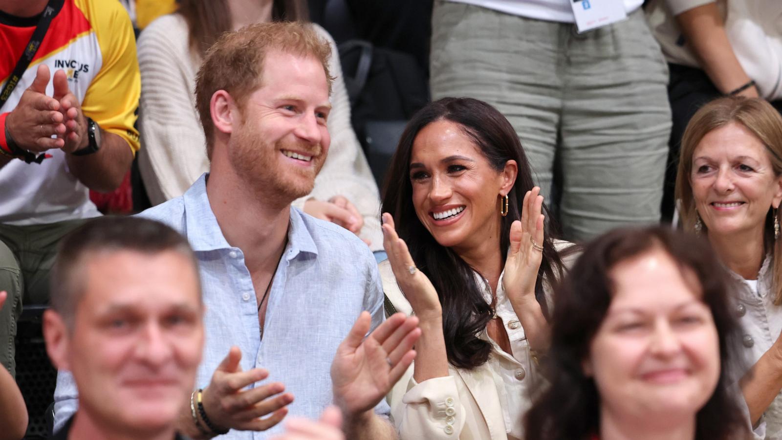 PHOTO: Prince Harry, Duke of Sussex and Meghan, Duchess of Sussex sit with Germany and Poland fans as they attend the sitting volleyball match between Poland and Germany Sept. 15, 2023 in Duesseldorf.