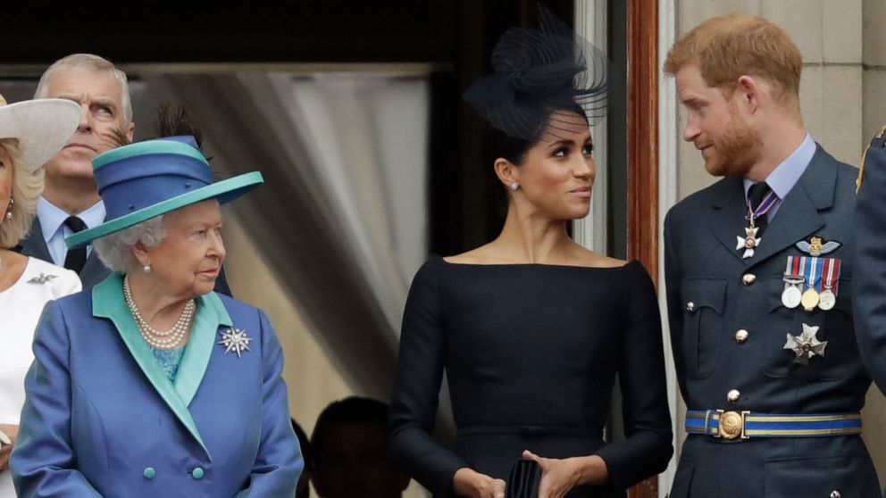 PHOTO: In this July 10, 2018 file photo Britain's Queen Elizabeth II, Meghan the Duchess of Sussex and Prince Harry stand on a balcony at Buckingham Palace in London.