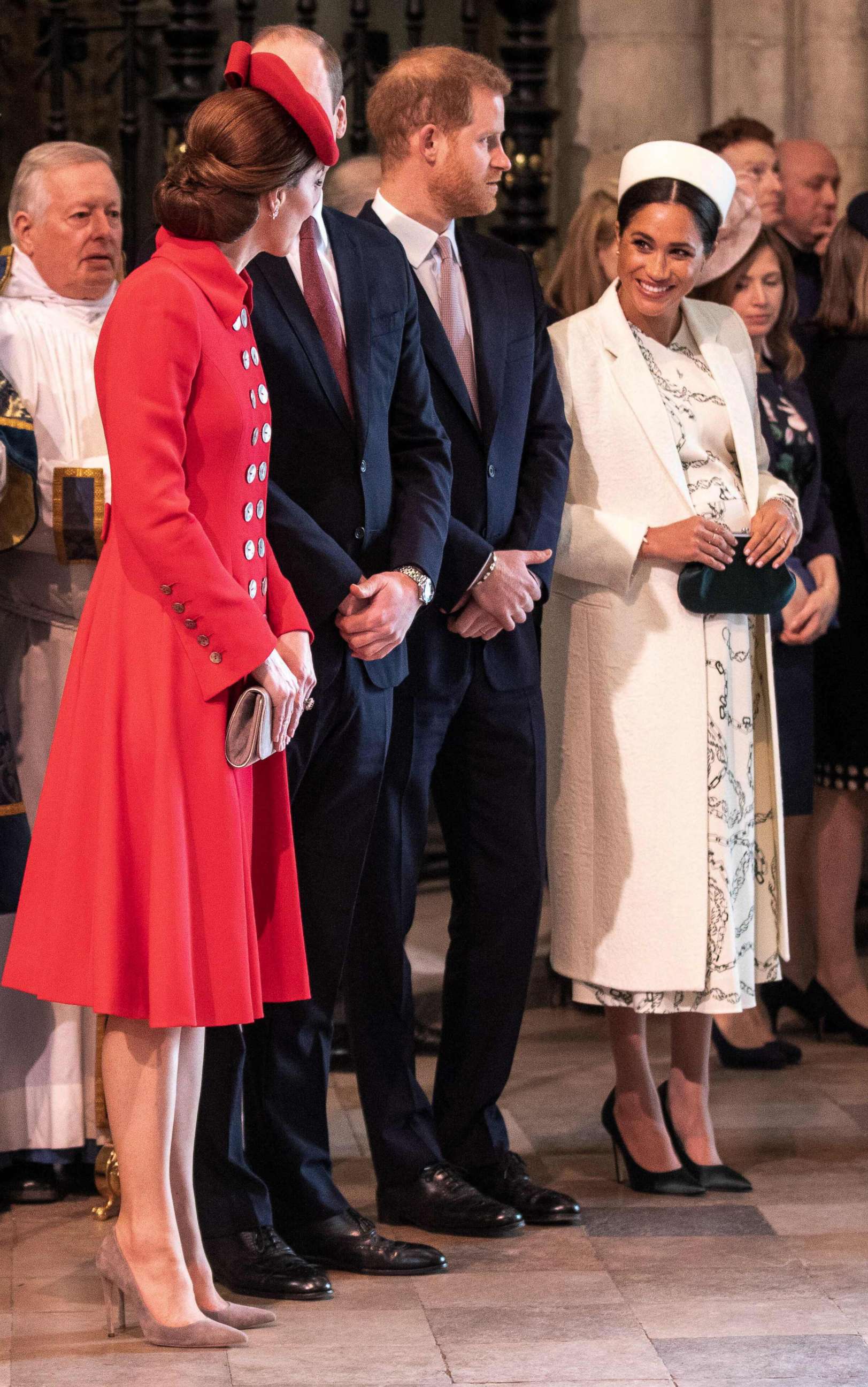 PHOTO: Britain's Catherine, Duchess of Cambridge, talks with Britain's Meghan, Duchess of Sussex, Prince William and Prince Harry stand by attending the Commonwealth Day service at Westminster Abbey in London on March 11, 2019.