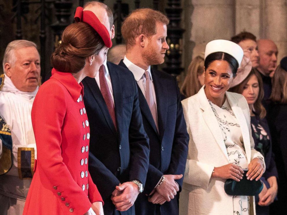 PHOTO: Britains Catherine, Duchess of Cambridge, talks with Britains Meghan, Duchess of Sussex, Prince William and Prince Harry stand by attending the Commonwealth Day service at Westminster Abbey in London on March 11, 2019.