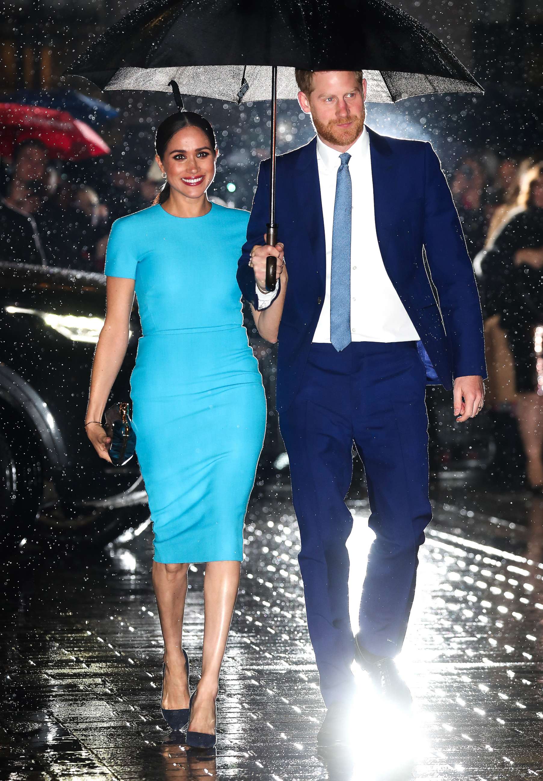 harry and meghan blue dress Harry and Meghan's Viral Umbrella Photo Speaks For Itself