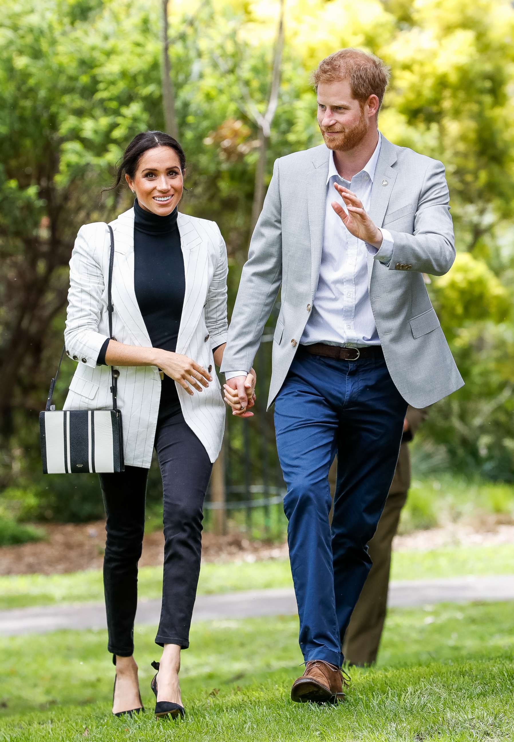 PHOTO: Prince Harry and Meghan, Duchess of Sussex, walk together during day two of the Invictus Games Sydney 2018 at Sydney Olympic Park on Oct. 21, 2018 in Sydney.
