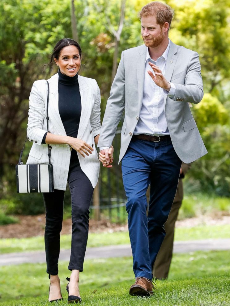 PHOTO: Prince Harry and Meghan, Duchess of Sussex, walk together during day two of the Invictus Games Sydney 2018 at Sydney Olympic Park on Oct. 21, 2018 in Sydney.