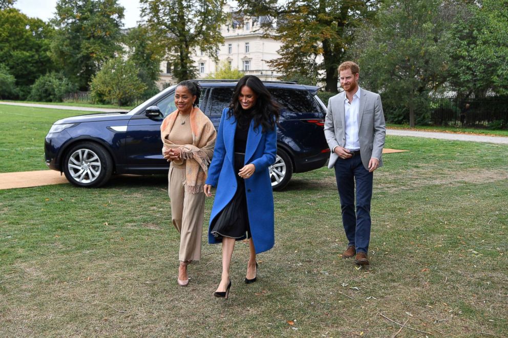 PHOTO: Meghan Markle, the Duchess of Sussex, accompanied by Britain's Prince Harry, the Duke of Sussex and her mother Doria Ragland walk to attend a reception at Kensington Palace, in London, Sept. 20, 2018.