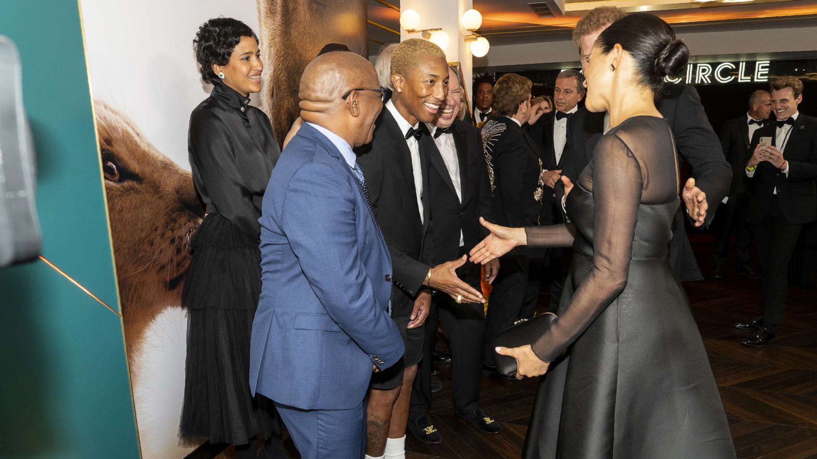 PHOTO: Prince Harry, Duke of Sussex and Meghan, Duchess of Sussex greet singer Pharrell Williams at the European Premiere of Disney's "The Lion King" on July 14, 2019, in London.