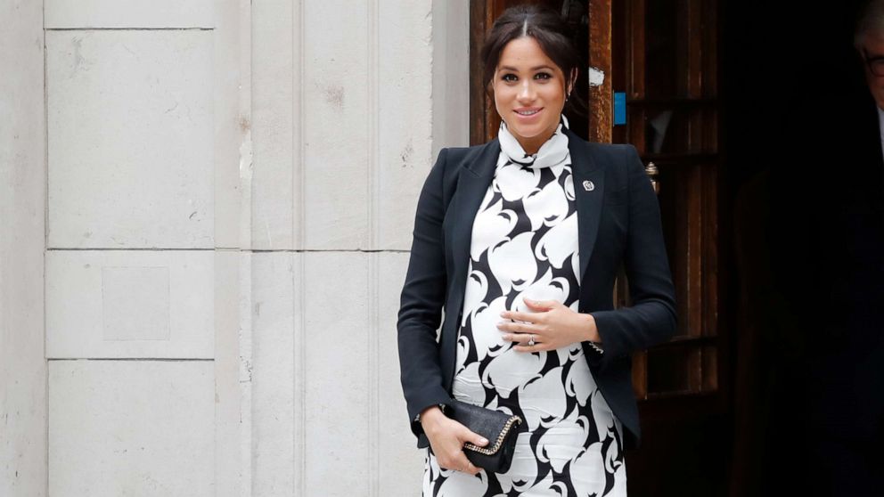 PHOTO: Britain's Meghan, Duchess of Sussex leaves an event to mark International Women's Day in London on March 8, 2019.