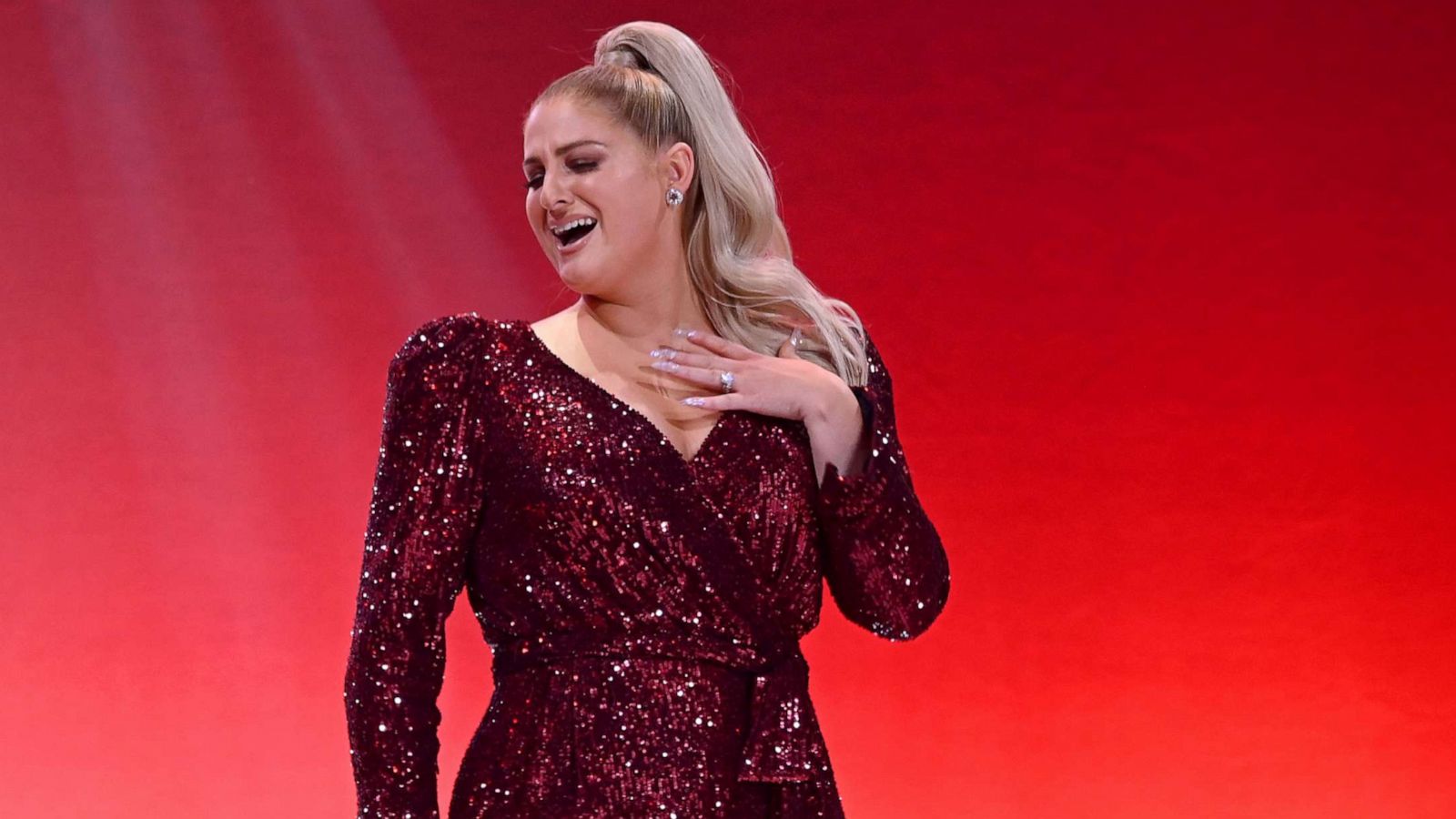 PHOTO: NEW YORK, NEW YORK - FEBRUARY 05: Meghan Trainor performs on the runway at The American Heart Association's Go Red For Women Red Dress Collection 2020 at Hammerstein Ballroom on February 05, 2020 in New York City.