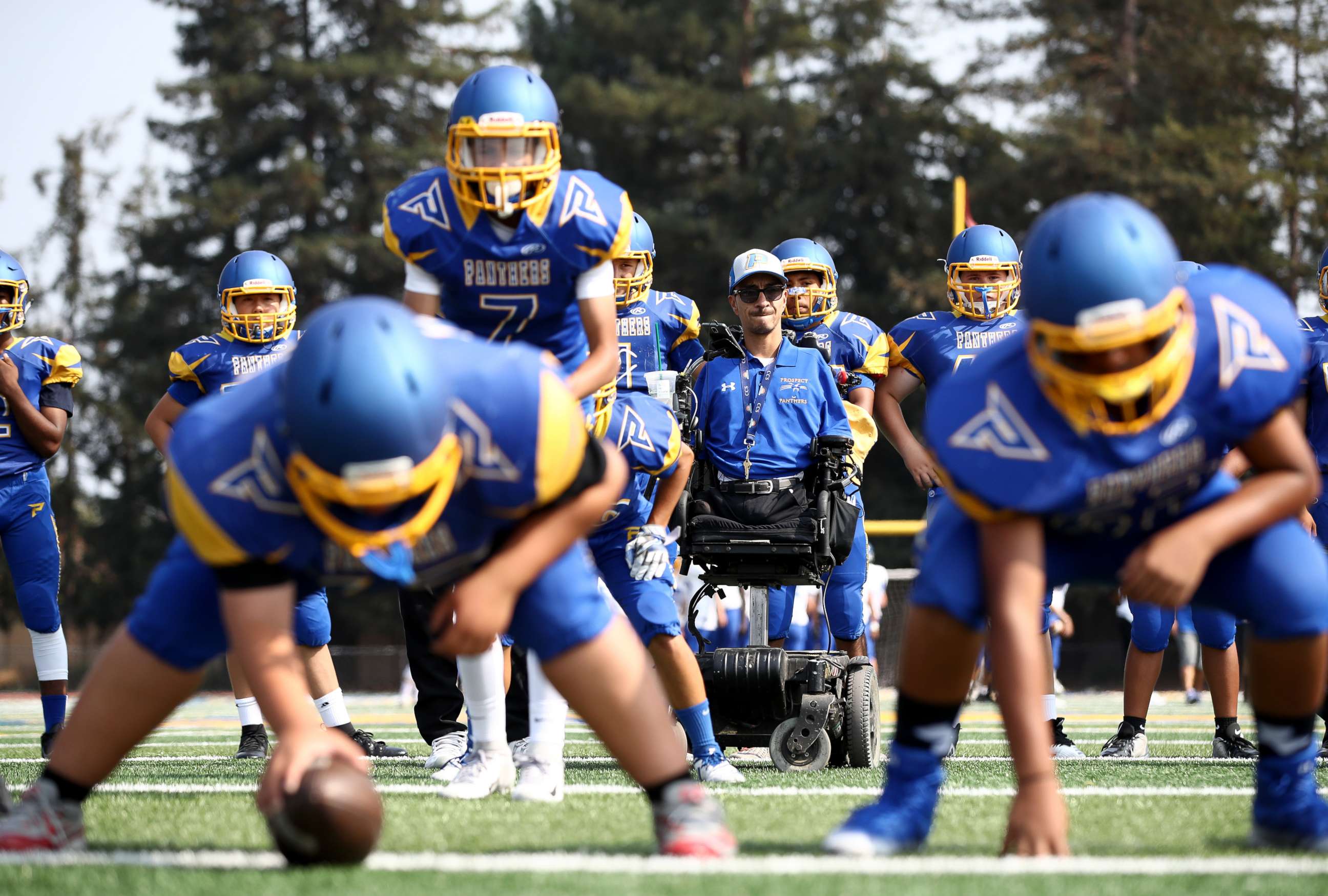 PHOTO: Rob Mendez, the head coach for the Prospect High School Junior Varsity football team, watches his team practice before their first game of the season against Santa Clara High School, Aug. 24, 2018, in Saratoga, Calif.