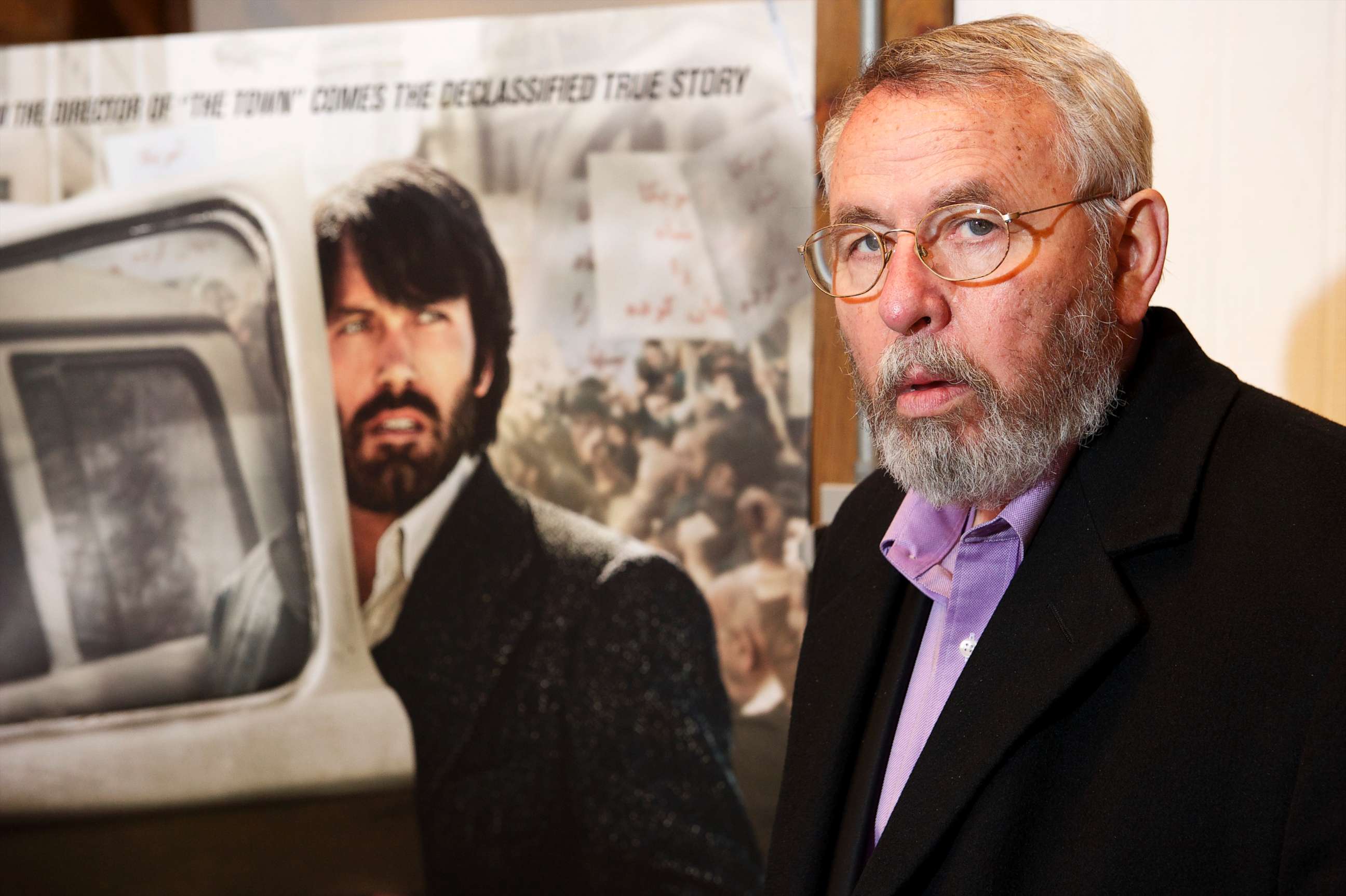 PHOTO: Retired CIA operative Tony Mendez photographed at his gallery in rural Maryland with the movie poster of Argo, and Ben Affleck in his role, Feb. 19, 2013. 