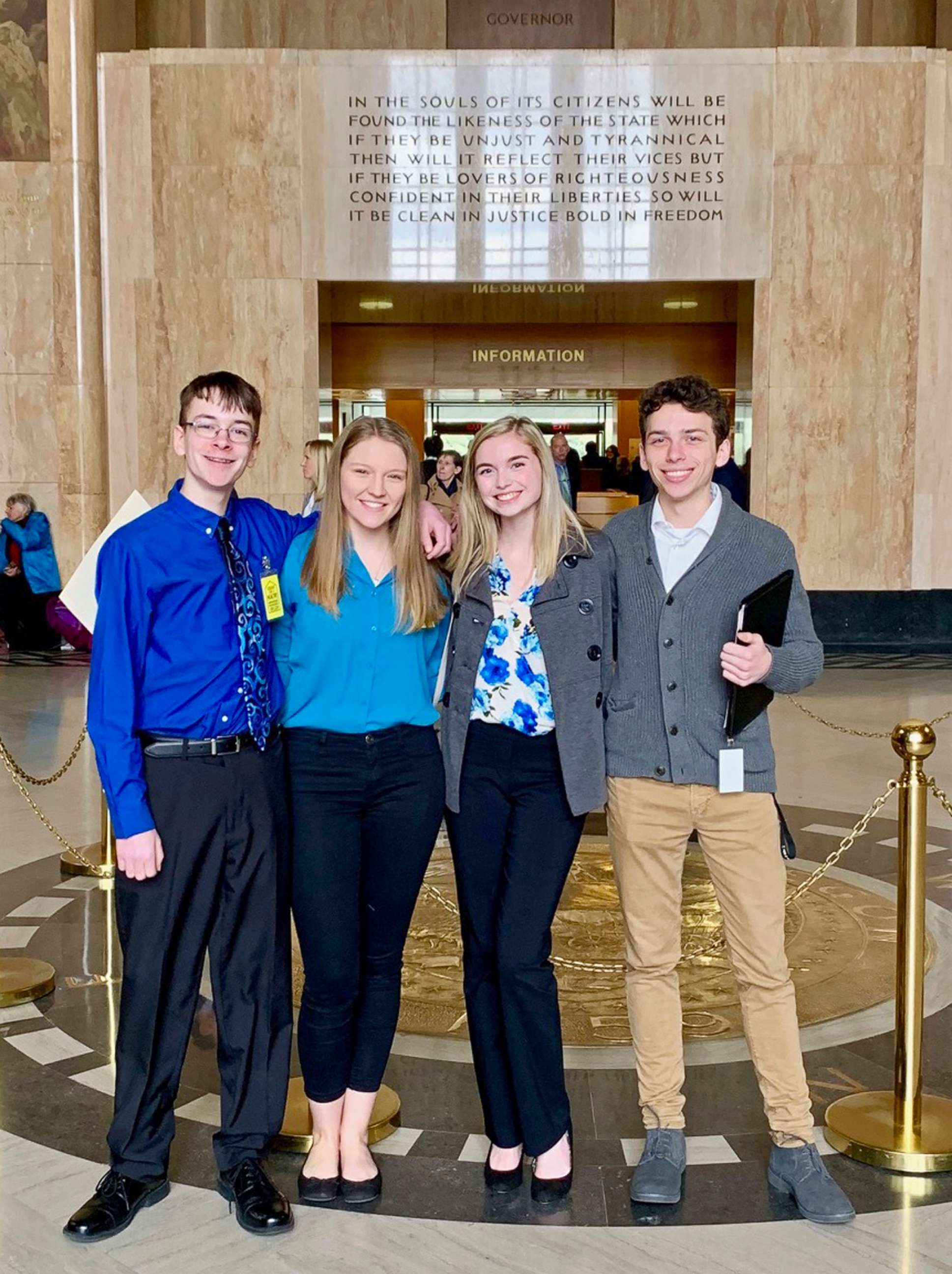PHOTO: This Feb. 6, 2019, photo shows from left, Sam Adamson, Lori Riddle, Hailey Hardcastle, and Derek Evans at the Oregon State Capitol in Salem, Ore.