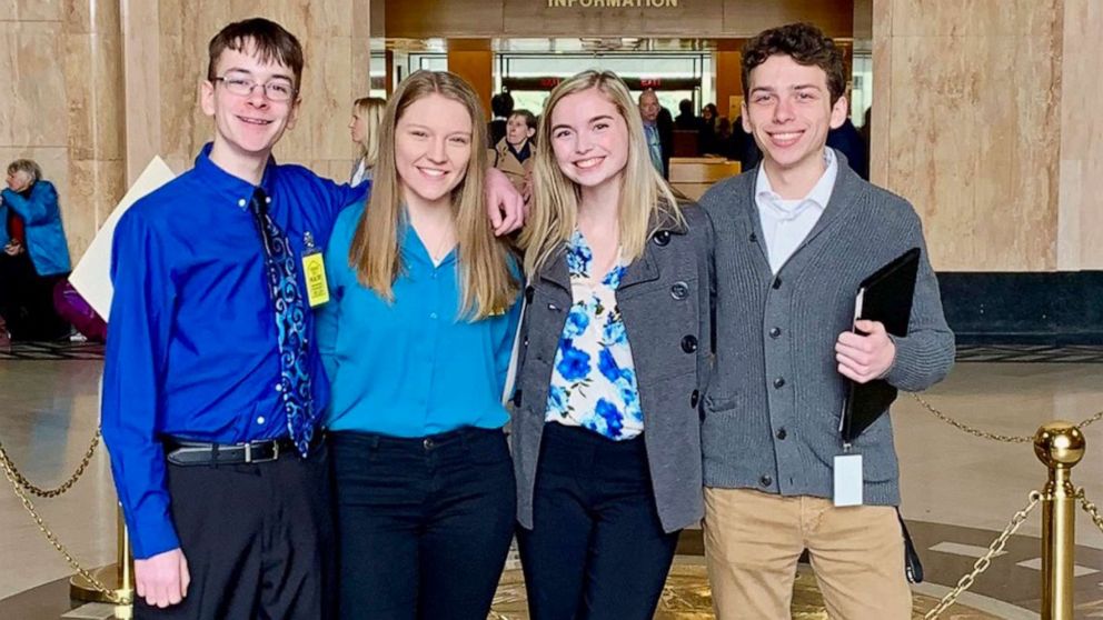 PHOTO: This Feb. 6, 2019, photo shows from left, Sam Adamson, Lori Riddle, Hailey Hardcastle, and Derek Evans at the Oregon State Capitol in Salem, Ore.