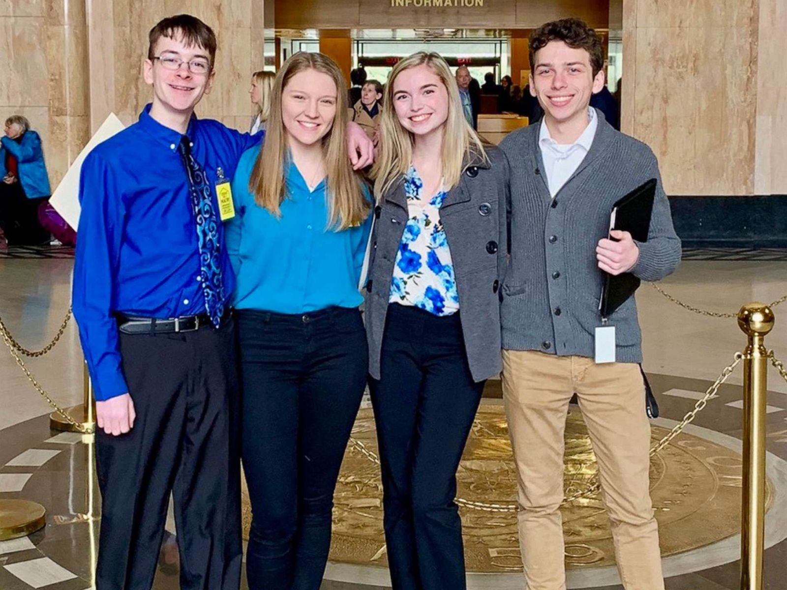 PHOTO: This Feb. 6, 2019, photo shows from left, Sam Adamson, Lori Riddle, Hailey Hardcastle, and Derek Evans at the Oregon State Capitol in Salem, Ore.