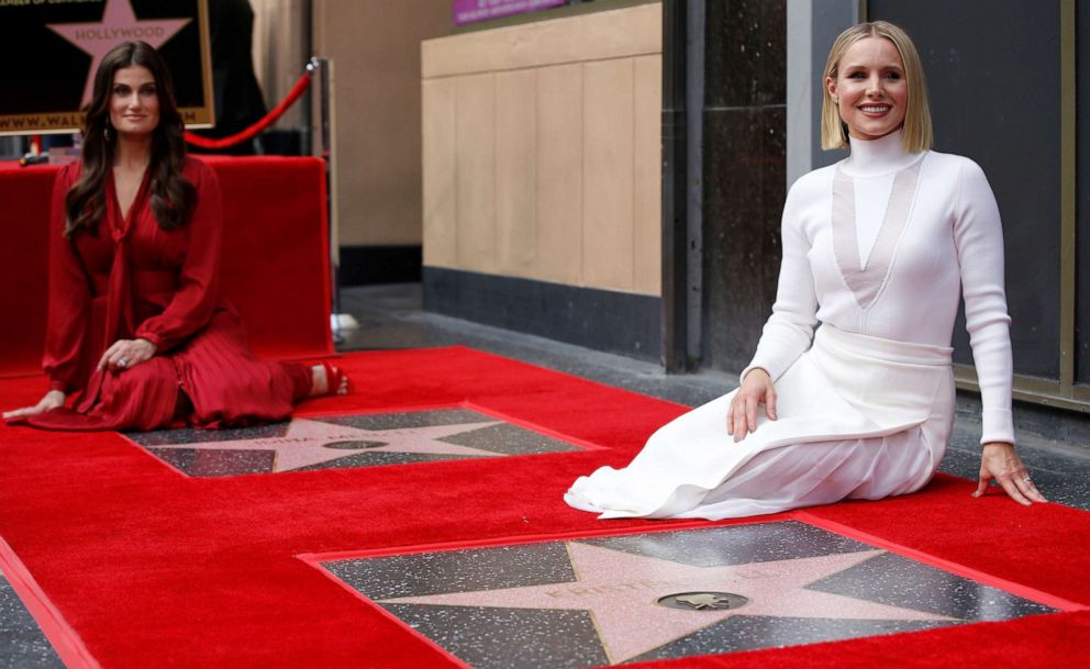 PHOTO: Kristen Bell, right, and Idina Menzel pose by their stars after they were unveiled on the Hollywood Walk of Fame in Los Angeles, Nov. 19, 2019.