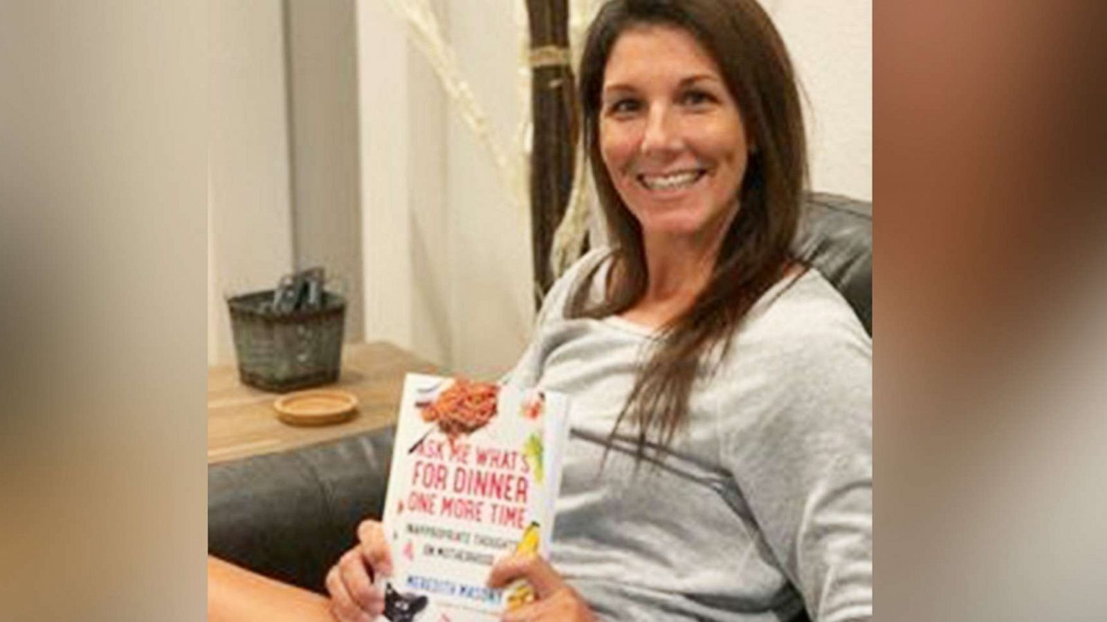 PHOTO: Meredith Masony, the founder of the popular parenting blog, poses with her new book, "Ask Me What's For Dinner One More Time: Inappropriate Thoughts on Motherhood." in an undated photo.