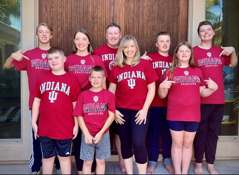 PHOTO: Sarah Merrill poses with her husband and children in t-shirts for Indiana University, where she plans to complete her residency in neurosurgery.