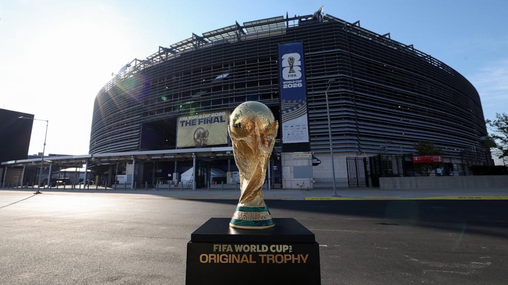 The FIFA World Cup Trophy is displayed at New York/New Jersey Stadium ahead of the FIFA World Cup Final on July 15, 2026 in East Rutherford, New Jersey. 