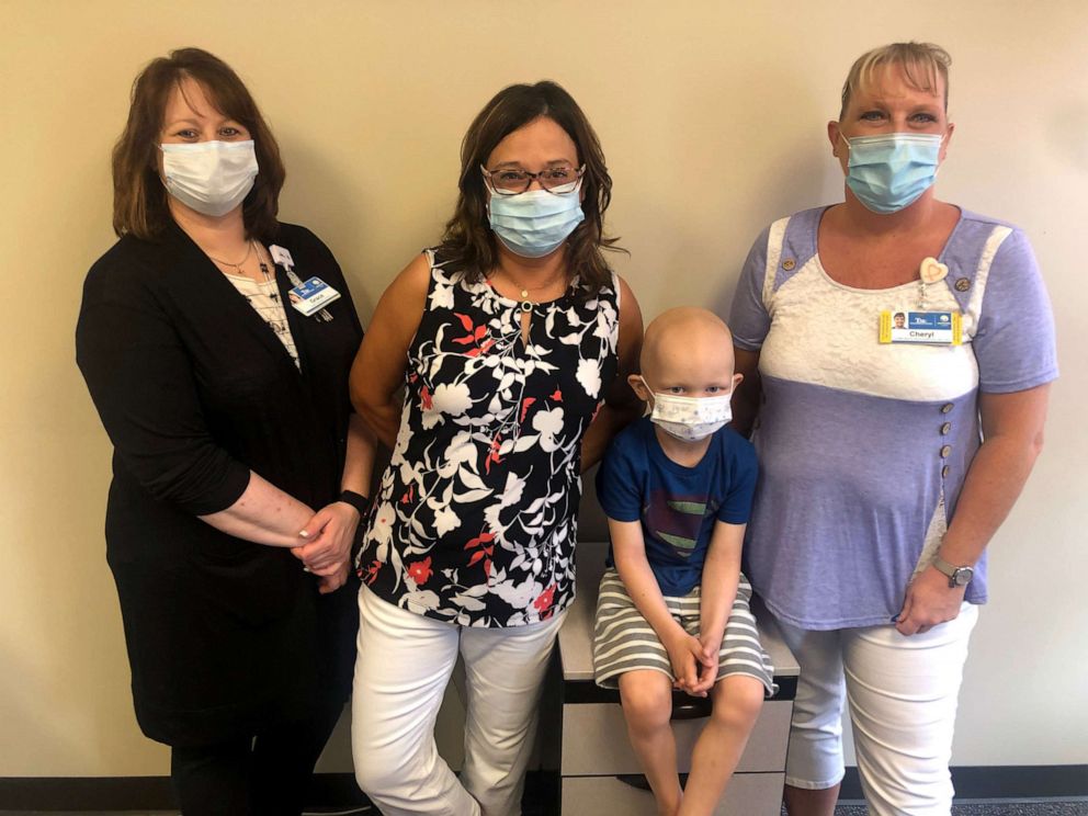PHOTO: Meyer Mixdorf, center, with Truman Medical Centers/University Health Grace Clark, far left, Johnna Schindlbeck, and Cheryl Grey, right.