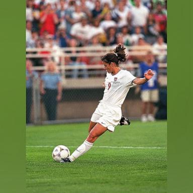 PHOTO: In this June 24, 1999, file photo, Mia Hamm of Team USA kicks the ball during the FIFA Women's World Cup game against Team Nigeria at Soldier Field in Chicago.